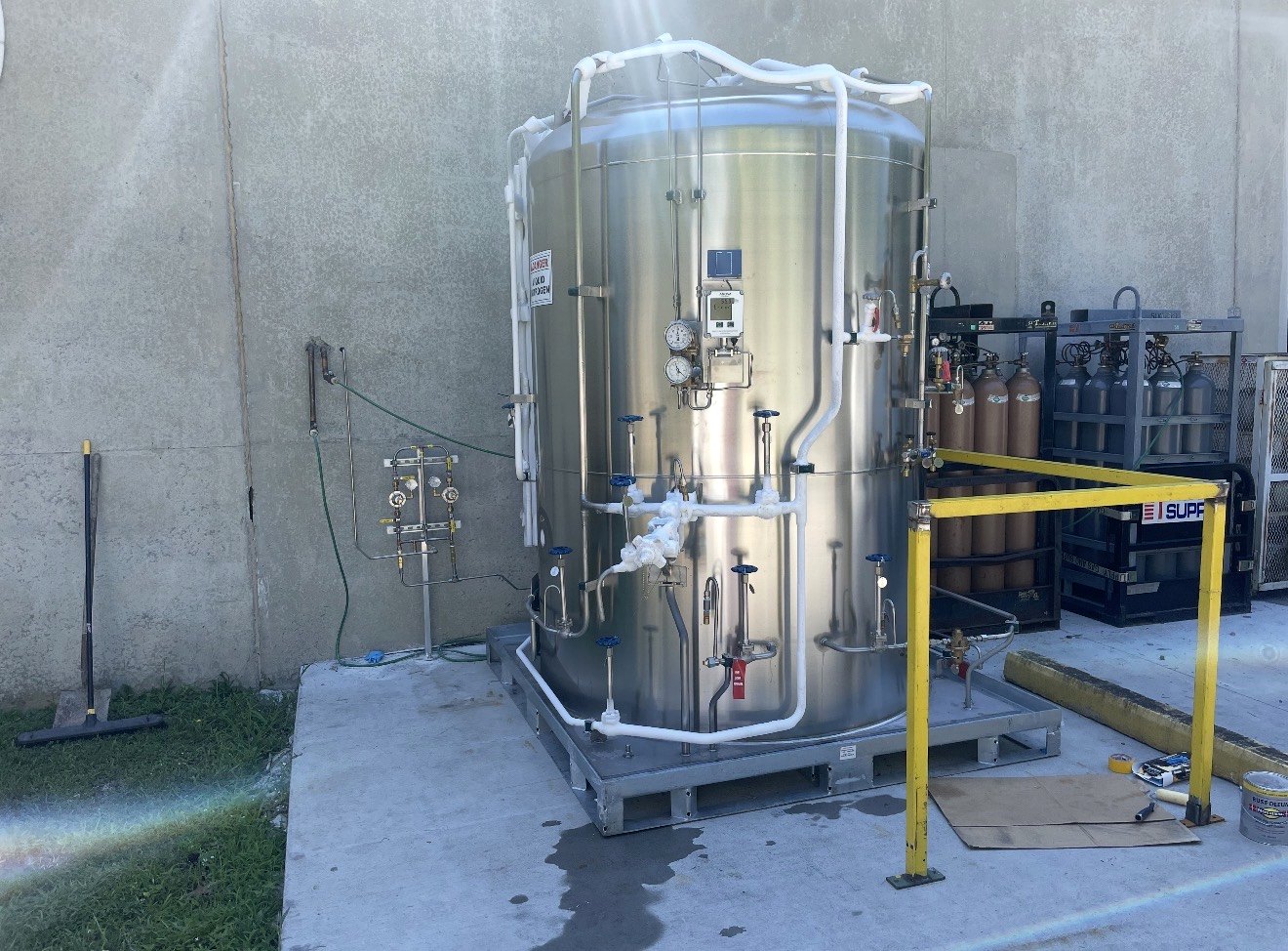 Bulk cryogenic vessel installation and stainless process piping